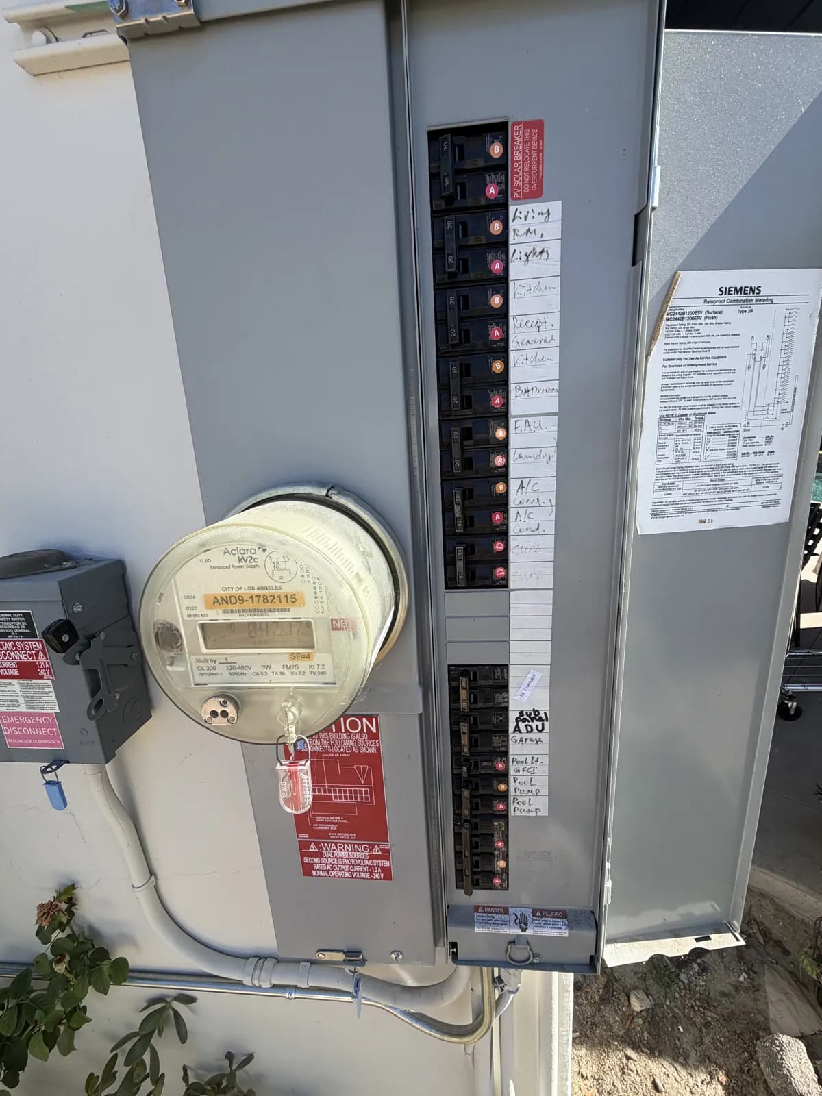 West Hills: a Siemens meter-main panel with breakers for rooftop solar and an EV charger
